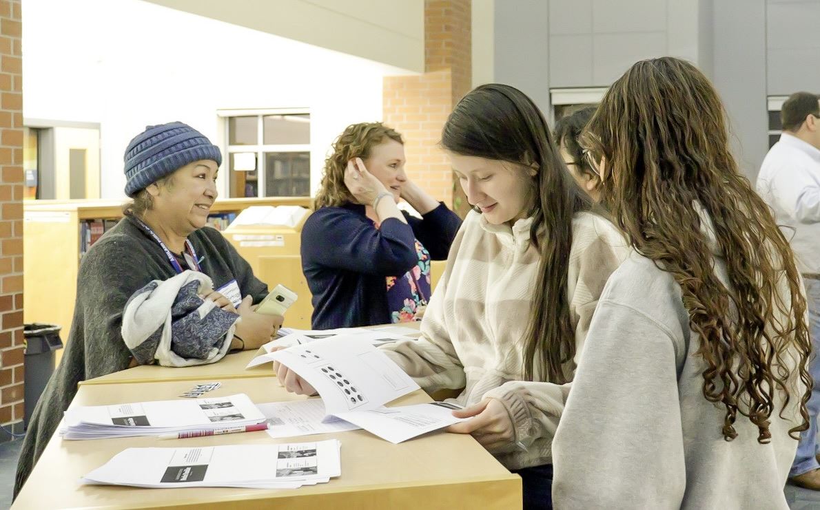 Two AHS students help out during the Jan. 10 EL Family Night Two AHS students help out during the Jan. 10 EL Family Night