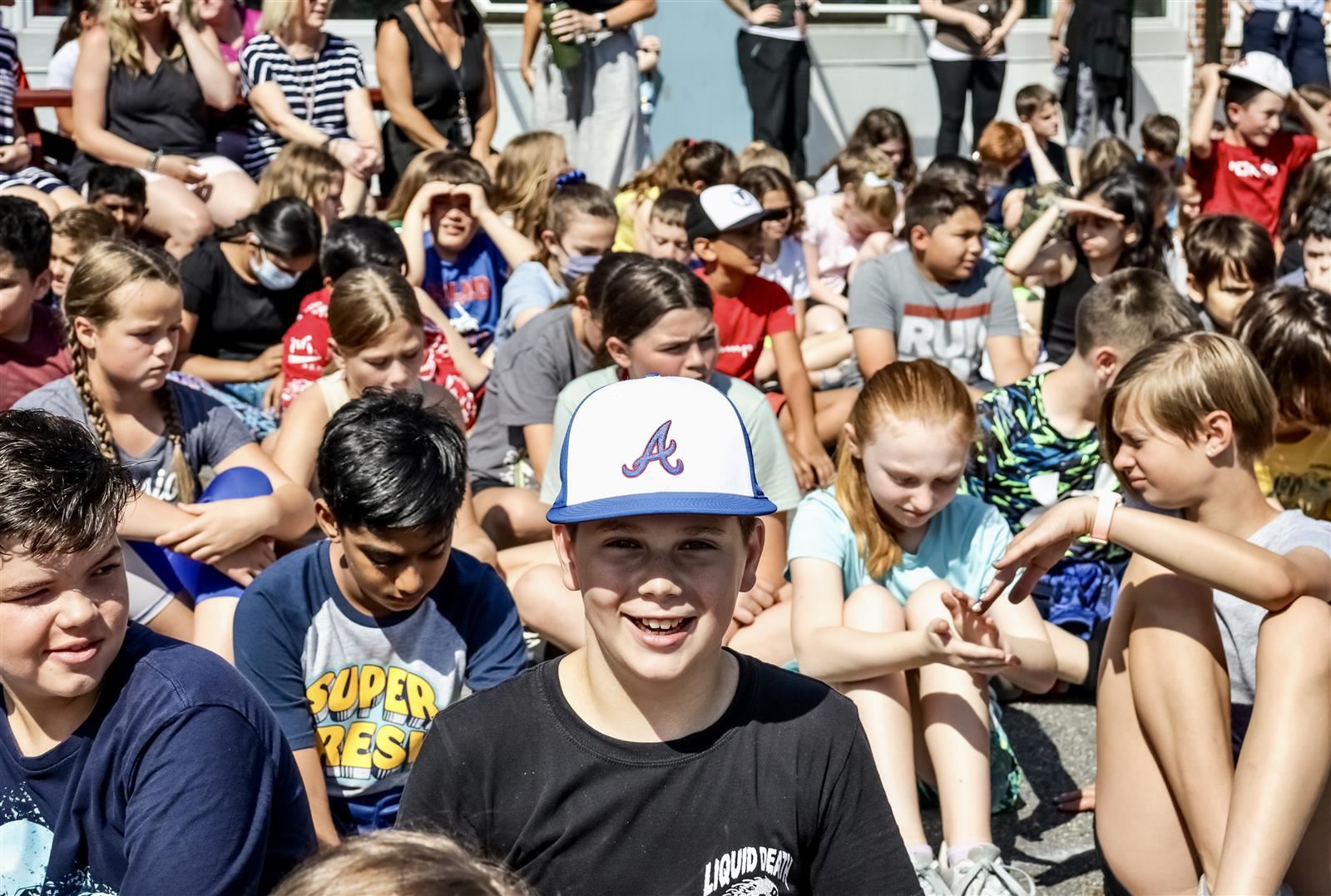 Smiling male student in a crowd of students Smiling male student in a crowd of students