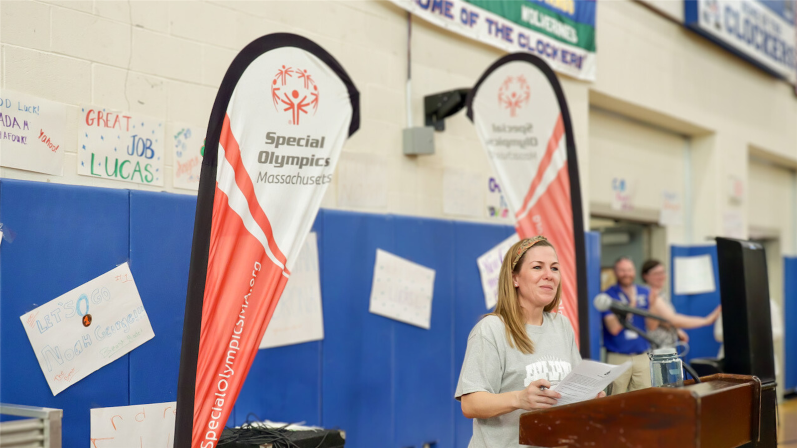  Director of Student Services Brittany Hawkins stands a podium during the 5-Town Special Olympics