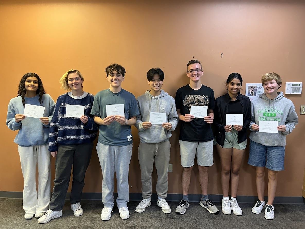  Seven AHS students post with their National Merit Scholarship certification